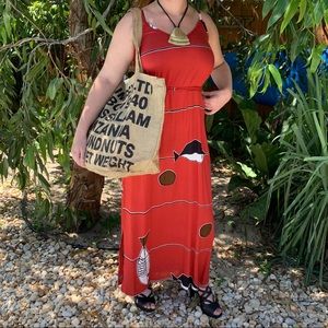 Spaghetti strap a-line dress with belted waist.